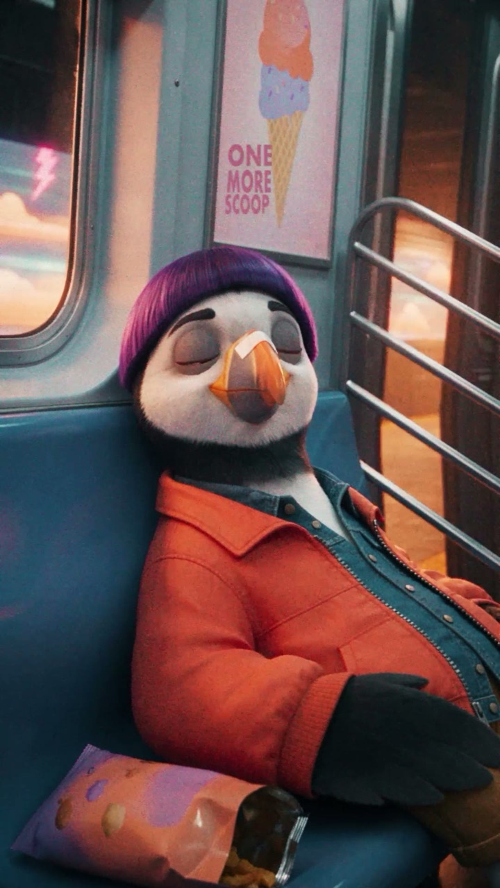 Puffin asleep on a night metro seat