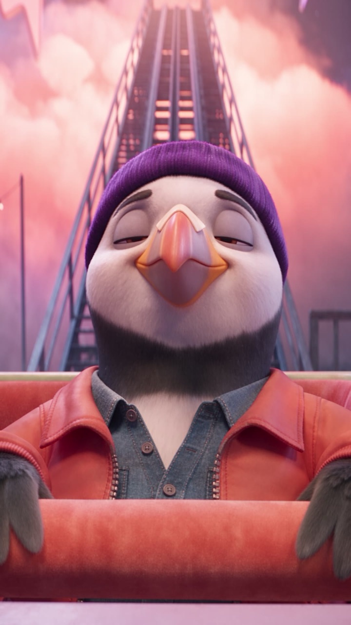 Puffin sitting in a roller coaster car, looking straight at you